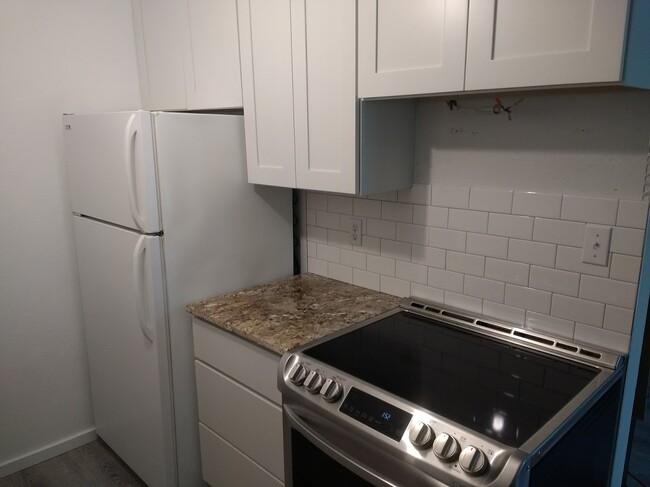 Granite Counter and tile backsplash - 3206 Pine Rd NE