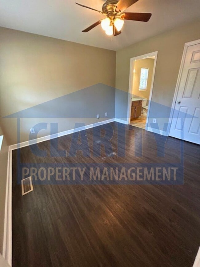 Building Photo - Charming three-bedroom home with carport!