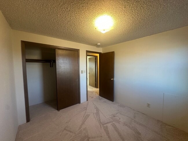 Building Photo - Two Bedroom, One and half bath townhome cl...