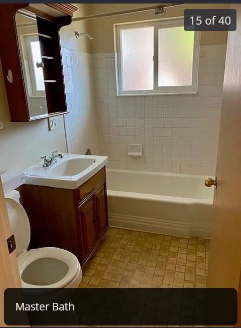 Main Floor Bath with tub and shower - 6898 Newman Street
