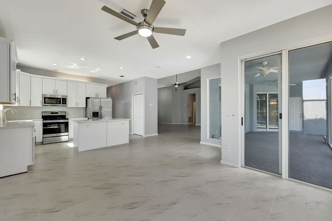 Building Photo - A BOATER'S PARADISE WITH THIS STUNNING 3 BEDROOM, 2 BATH WATERFRONT POOL HOME W/DOCK & BOAT LIFT ...