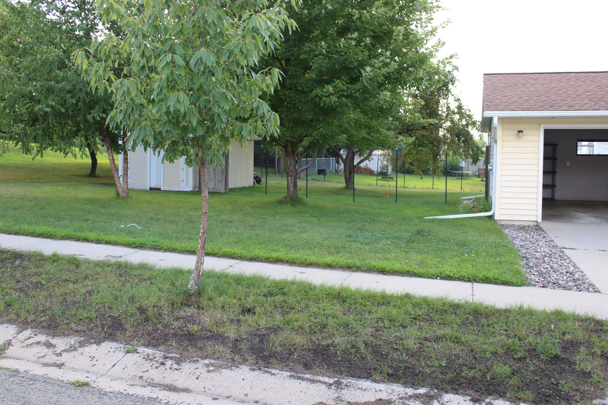 reseeding this area too. This run of fence will also be a privacy fence eventually and behind shed. - 3991 Whiting Ln NE