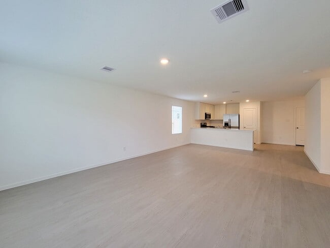 Building Photo - This lovely single-level home showcases a spacious open floorplan shared between the kitchen, din...