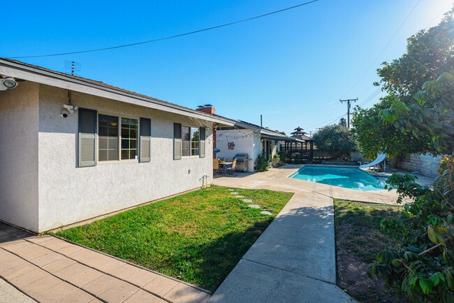 Building Photo - Luxury Estate with Sparkling Pool & Elegant Amenities