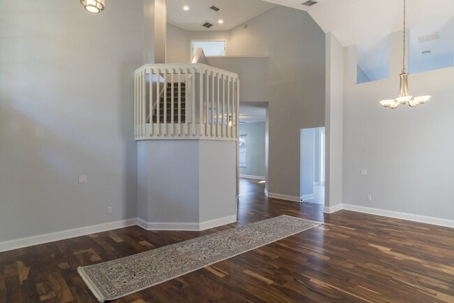 Building Photo - Beautiful 4/2 home Located on a tree lined street in the gate of country club community of the Hu...