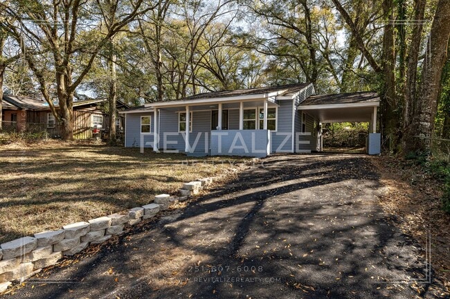 Building Photo - 3 BR 2 BA Home with Fenced Yard & Carport
