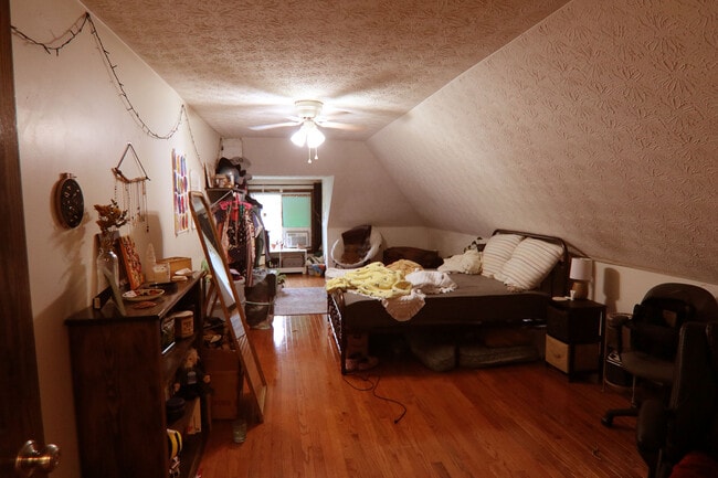 View 1 of 3rd floor bedroom with added window A/C unit - 372 E Oakland Ave