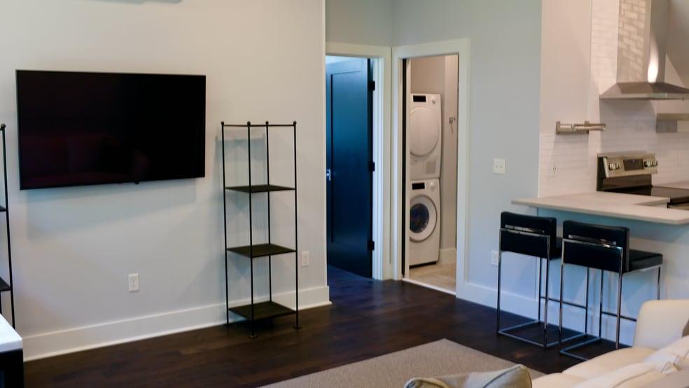 Living room with wall-mounted large screen TV - 297 Durham Point Rd