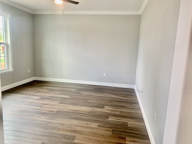 Building Photo - "Spacious 4-Bedroom 3-Bath with In-Law Suite & Granite Finishes in Palm Bay!"