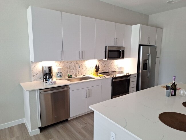 Building Photo - Your urban prairie sanctuary is here! One of a kind apartment homes where art, luxury & convenien...