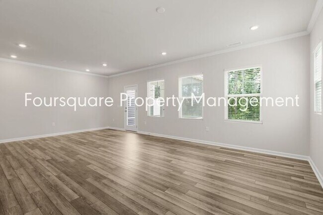 Building Photo - Coming Soon; July 27, 2026 : End unit ToSpacious End-Unit Townhome with 2nd Floor Loft, Screened-...