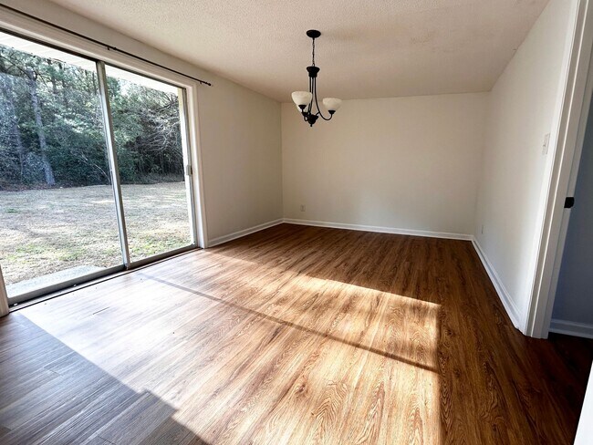 Building Photo - NOW AVAILABLE! 3 Bedrooms/1 1/2 Bath with Double living room space.