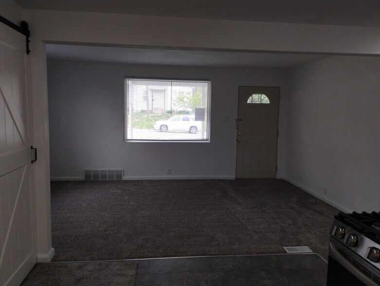 Living room has new carpet & newly painted - 246 Brackett St