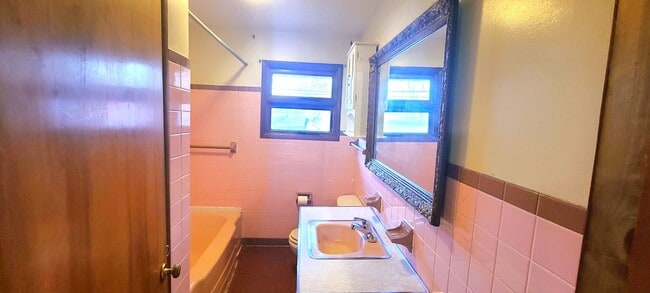 Building Photo - HALF OFF FIRST MONTH RENT! Single family brick home with full unfinished bsmt & detached garage