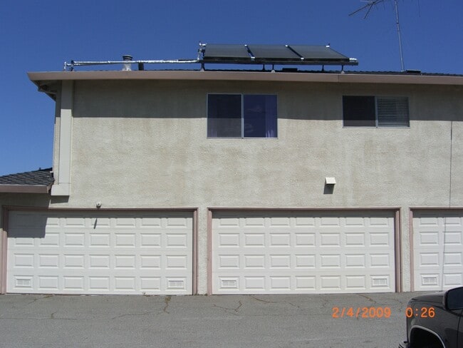 back of building with garage entry - 3140 Neal Ave