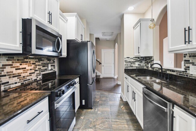 Building Photo - Pet Friendly Three Bedroom with Bonus!