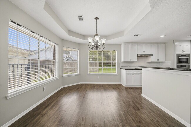 Building Photo - Refreshed 4-Bedroom in New Territory with New Paint, New Floors, and Lawn Care Included.