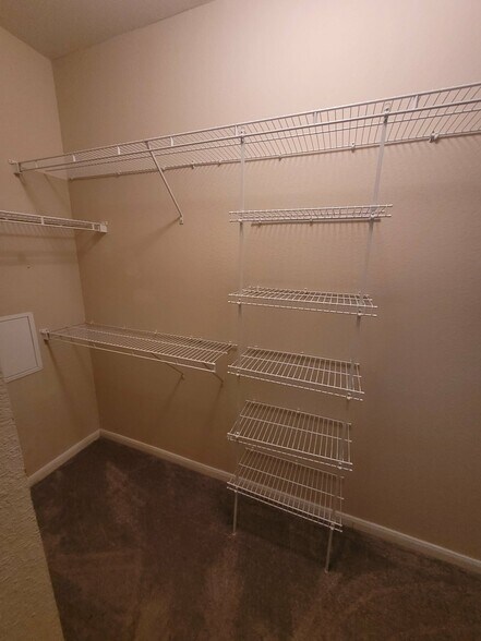 Walk-in bedroom closet - 7575 Kirby Dr