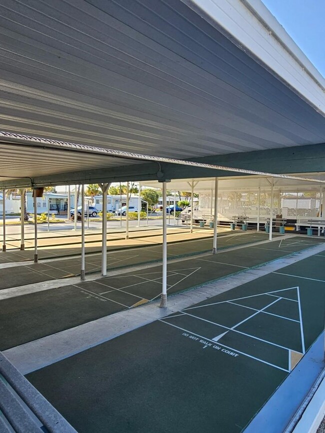 Building Photo - Beautiful fully furnished one bedroom, one bath manufactured home in a 55+ deed restricted gated ...