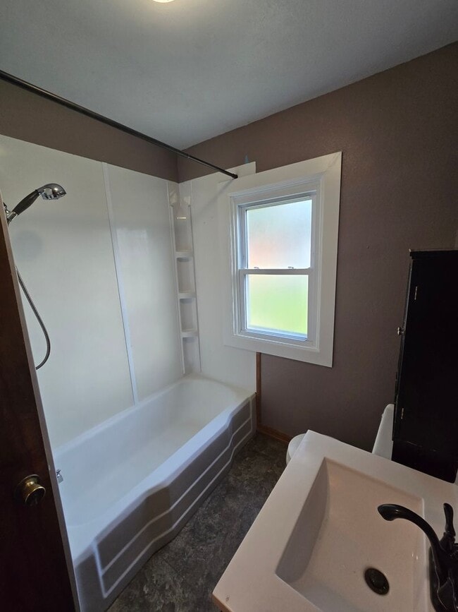 Building Photo - 3 bedroom, large privacy fenced in yard, oversized garage