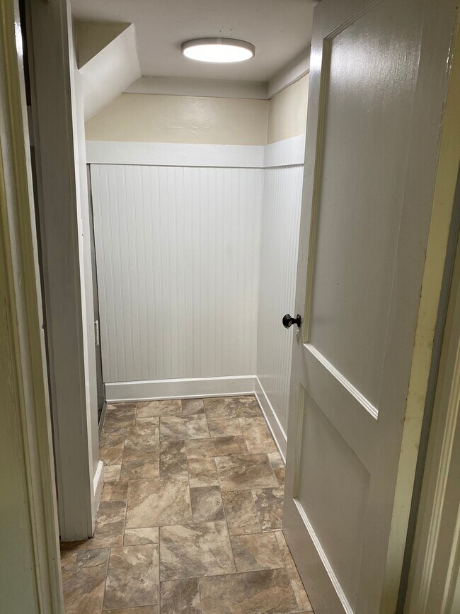 Convenient coat room. Now has colonial iron hooks surrounding! - 3901 N Pennsylvania St