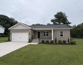 Building Photo - Brand-New Three-Bedroom Brick Home with Two-Car Garage