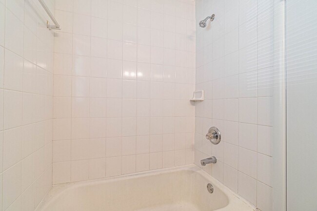 Building Photo - Three Bedroom Home in tree filled neighborhood! Lawn care included!