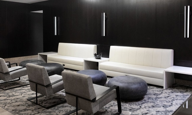 photo of 201 Pearl St Lobby with modern lighting, lounge seating, and convenient power outlets - 2 Gold St