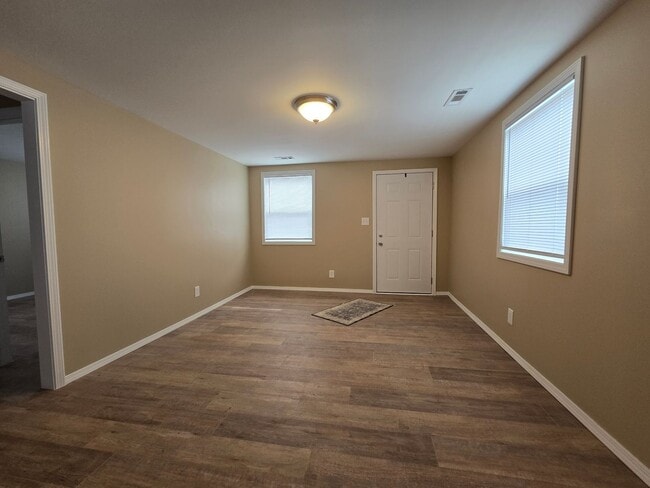 Building Photo - Corner Lot. Fenced Yard. Smells Like Fresh Paint & Good Decisions