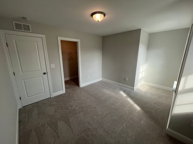 Building Photo - Newly Built 4BD, 3BA Cary Townhome with Modern Amenities and Screened-In Patio