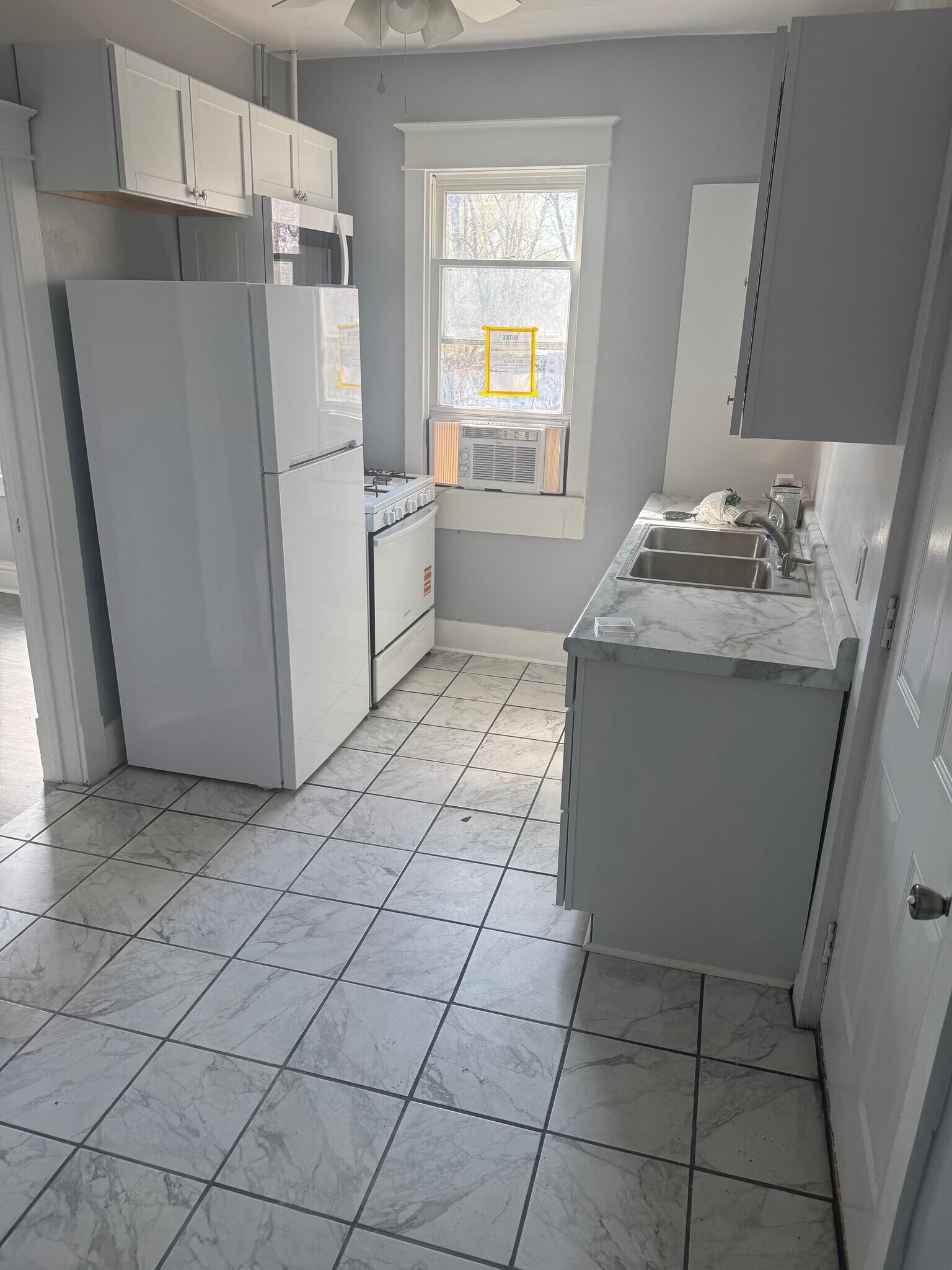 Kitchen w. stove, refrigerator, and microwave - 304 Arthur Ave