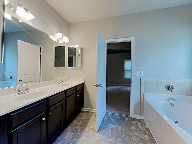 Building Photo - Now Leasing! Your New Home Awaits! 4BR Bea...
