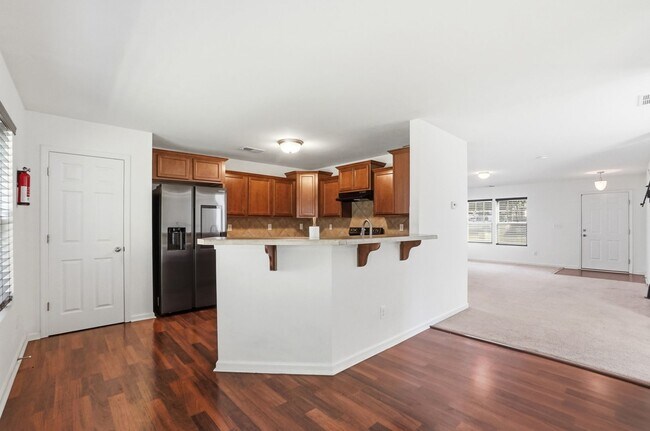 Building Photo - Spacious 4BR Home with New Carpet & Fenced Backyard
