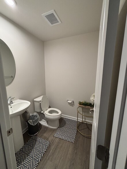 First floor half bath - 48 Sidney Ln