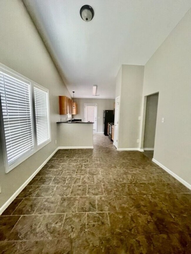 Building Photo - Welcome to the Adorable 3 bedroom 2 bath 1 car garage Home, located in the vibrant city of Charlo...