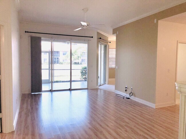 Building Photo - Experience Bell Tower Park. GATED ground floor 2 Bed 2 Bath Den 1 Car Garage Condo.