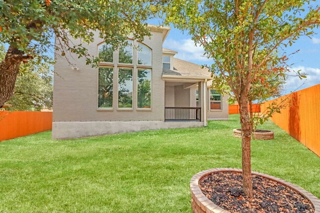 Building Photo - "Spacious 4-Bedroom Sanctuary with Cozy Fireplace in San Antonio's Prime Location!"