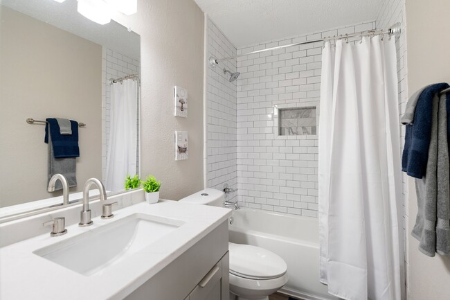 Updated Bathrooms with Tubs and Showers - Mill House at East Cobb Apartment Homes