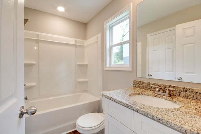 Building Photo - Two Story Duplex With Hardwood Flooring and White Cabinetry