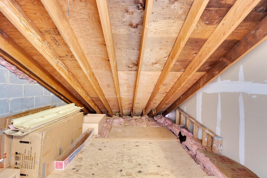 Versatile attic space offering ample storage or potential for creative use. - 3320 Richmond Ct
