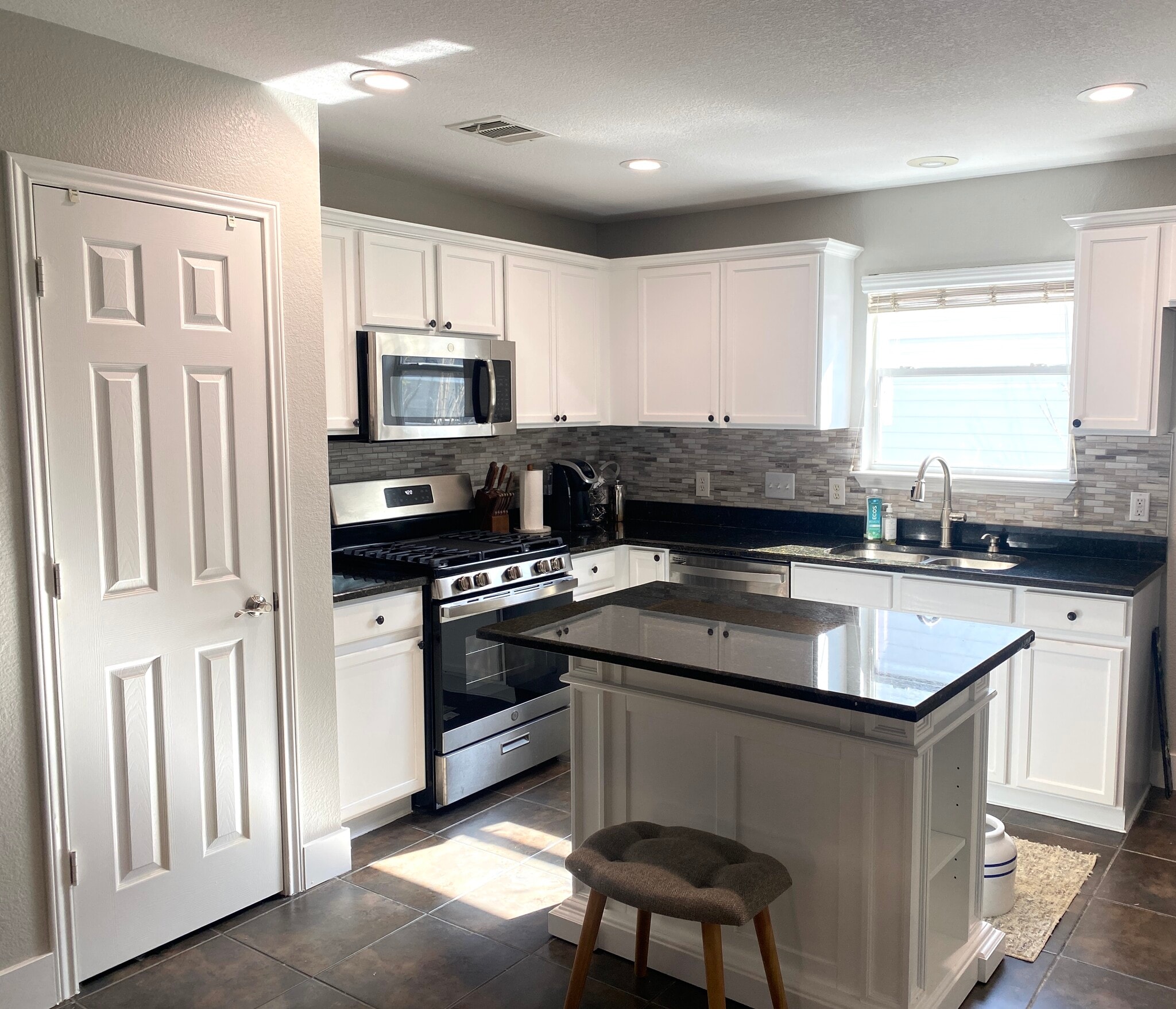 Fully-remodeled kitchen with recessed lighting, stainless steel appliances and granite - 615 Big Spring Dr