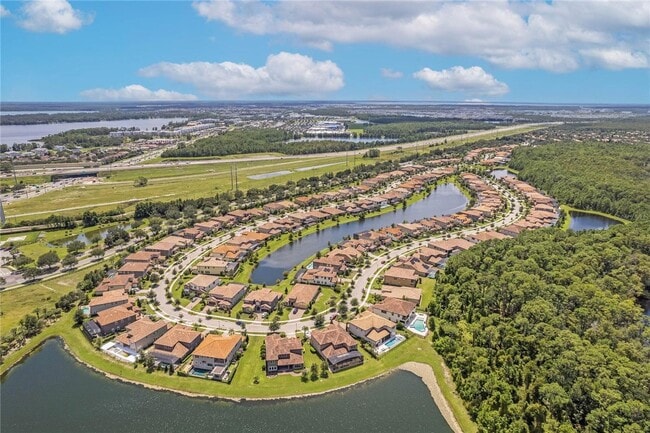 Building Photo - Gorgeous 3/2 Mediterranean Villa with Waterfront Screened Patio and 2-Car Garage in the Prestigio...