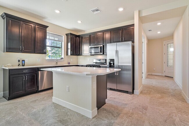 Building Photo - **Coach Home w/ Private Pool in Esplanade Lake Club **