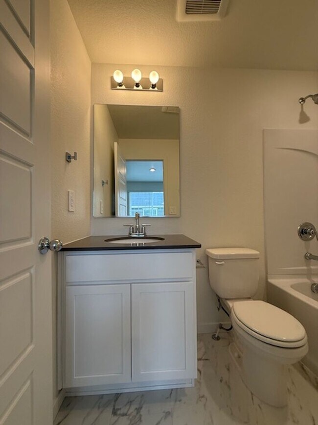 Building Photo - New 2 Bedroom Townhome + 2 Car Garage