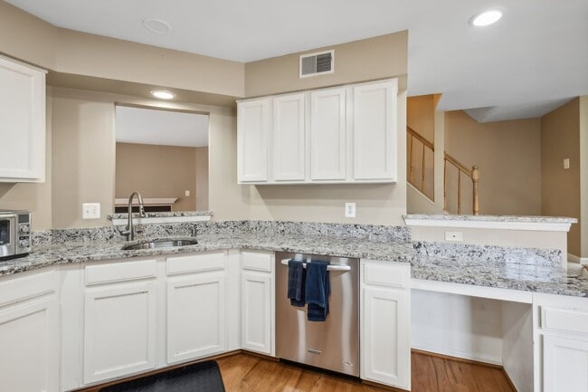 Building Photo - Modern Brick End-Unit Townhome with Stunning Upgrades and Serene Wooded Views