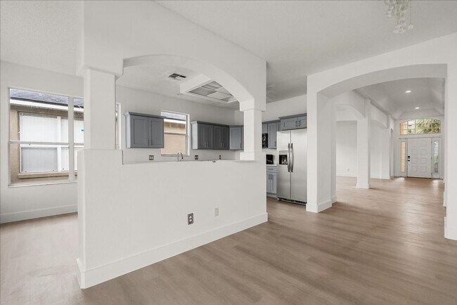 Building Photo - Stunning 4-Bedroom Lakefront Pool Home in Bridgeview at Meadow Woods