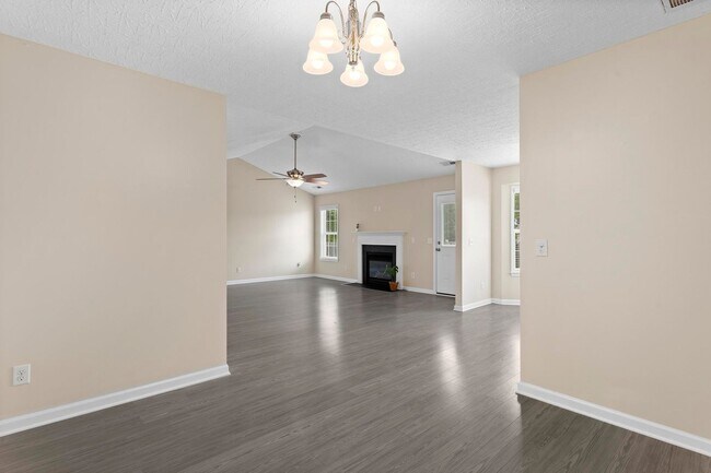 Building Photo - House with Fenced Back Yard Available!