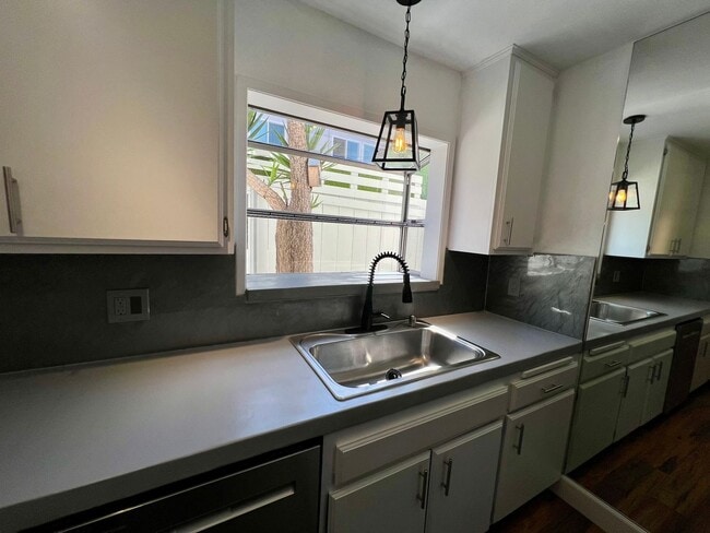 Building Photo - TWO PARKING SPACES INCLUDED! In Unit Washer & Dryer! Large Private Patio for Bikes, Boards and Bb...