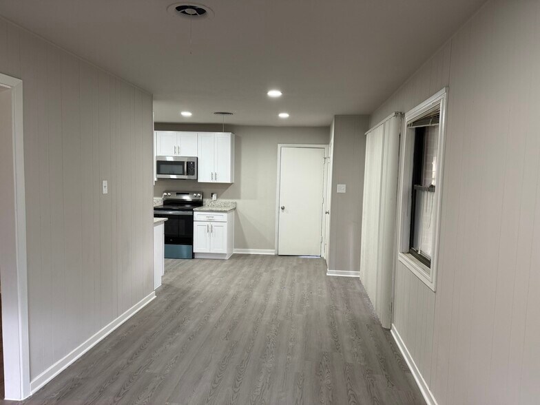All living space have new "wood-look" vinyl flooring. - 8274 Lifford Pl