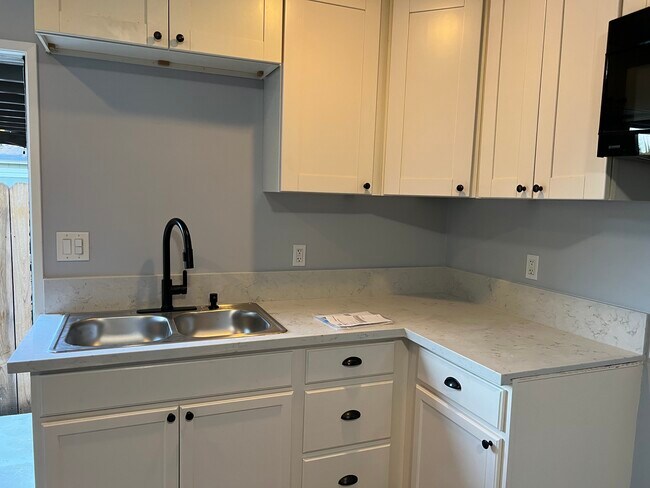 New kitchen with electric range and fridge - 6006 Donna Ave